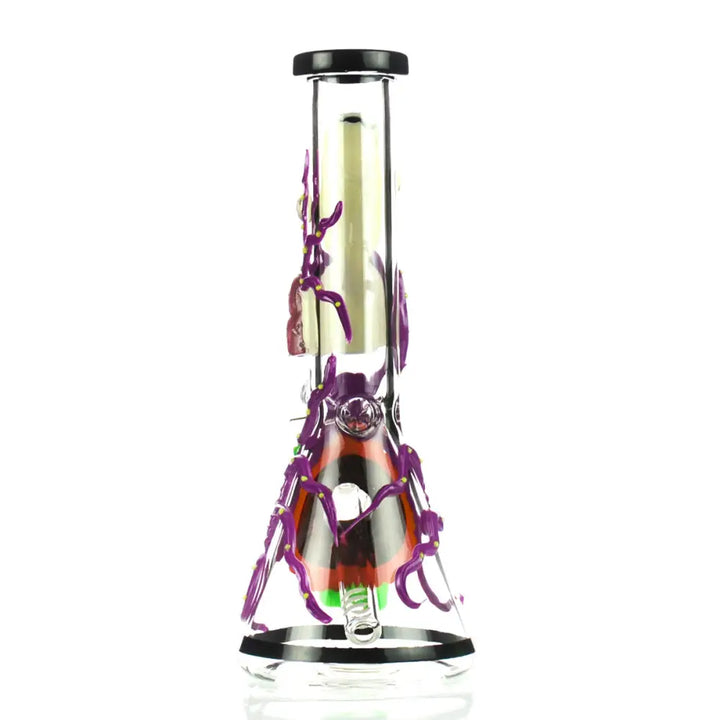 Full view of a clear glass beaker water pipe with 3D purple spider decorations and an orange and black spider body design.
