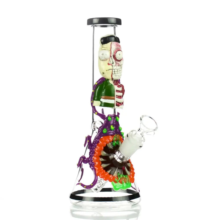 Clear glass beaker water pipe featuring a detailed 3D art design of a character, half-flesh and half-skeleton, with a monstrous purple and orange mouth at its base.