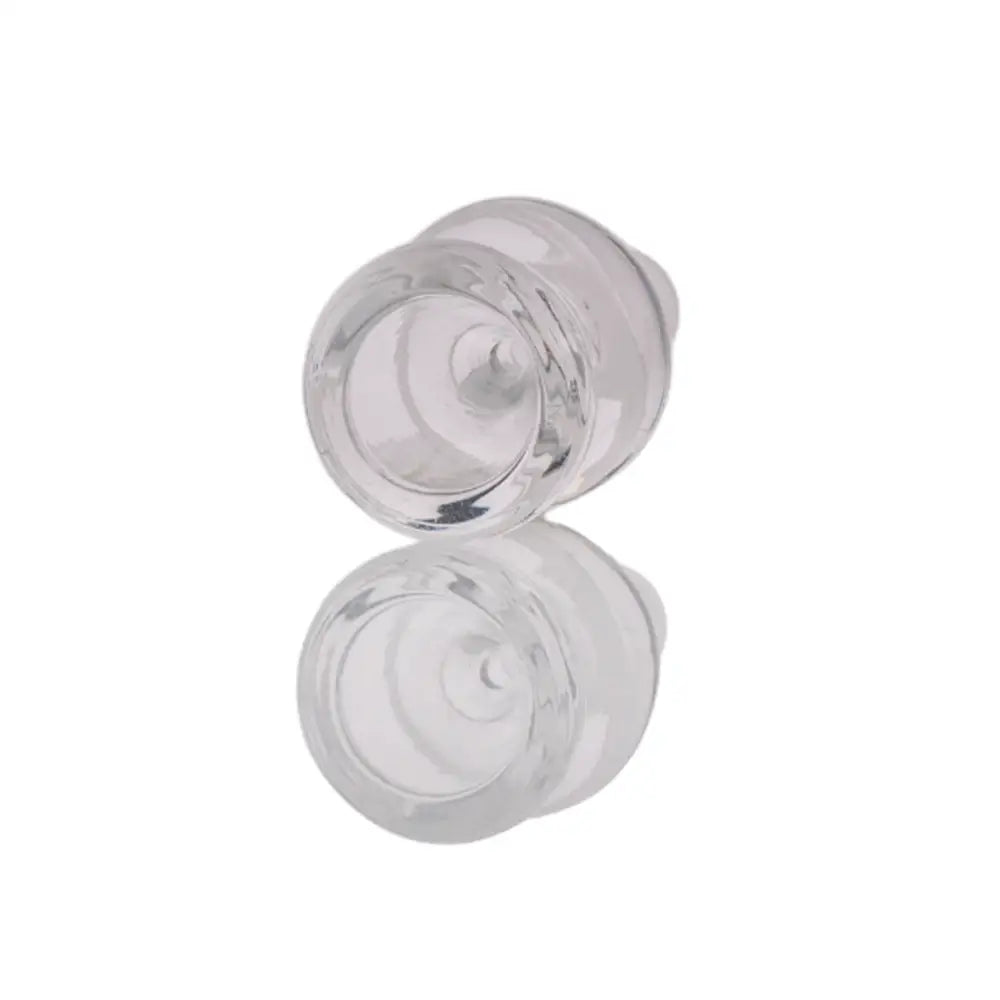 Close-up, angled view of a clear glass martini bowl with a distinct outer ring, showing its hollow interior and reflective surface on a white background.