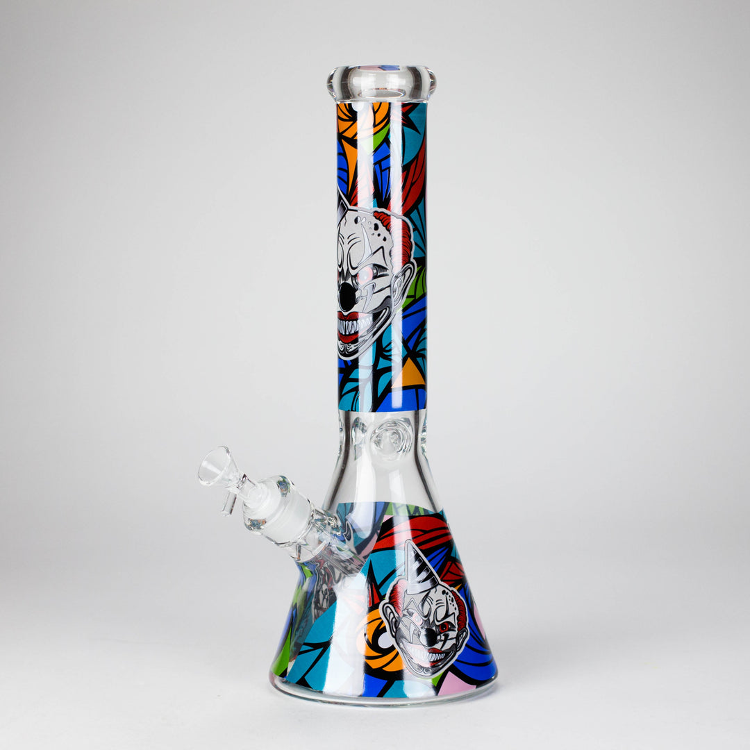 Close-up detail of the clear glass beaker water pipe's base, showing the submerged downstem and water.