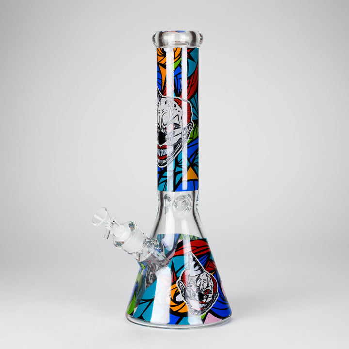 Close-up detail of the clear glass beaker water pipe's base, showing the submerged downstem and water.