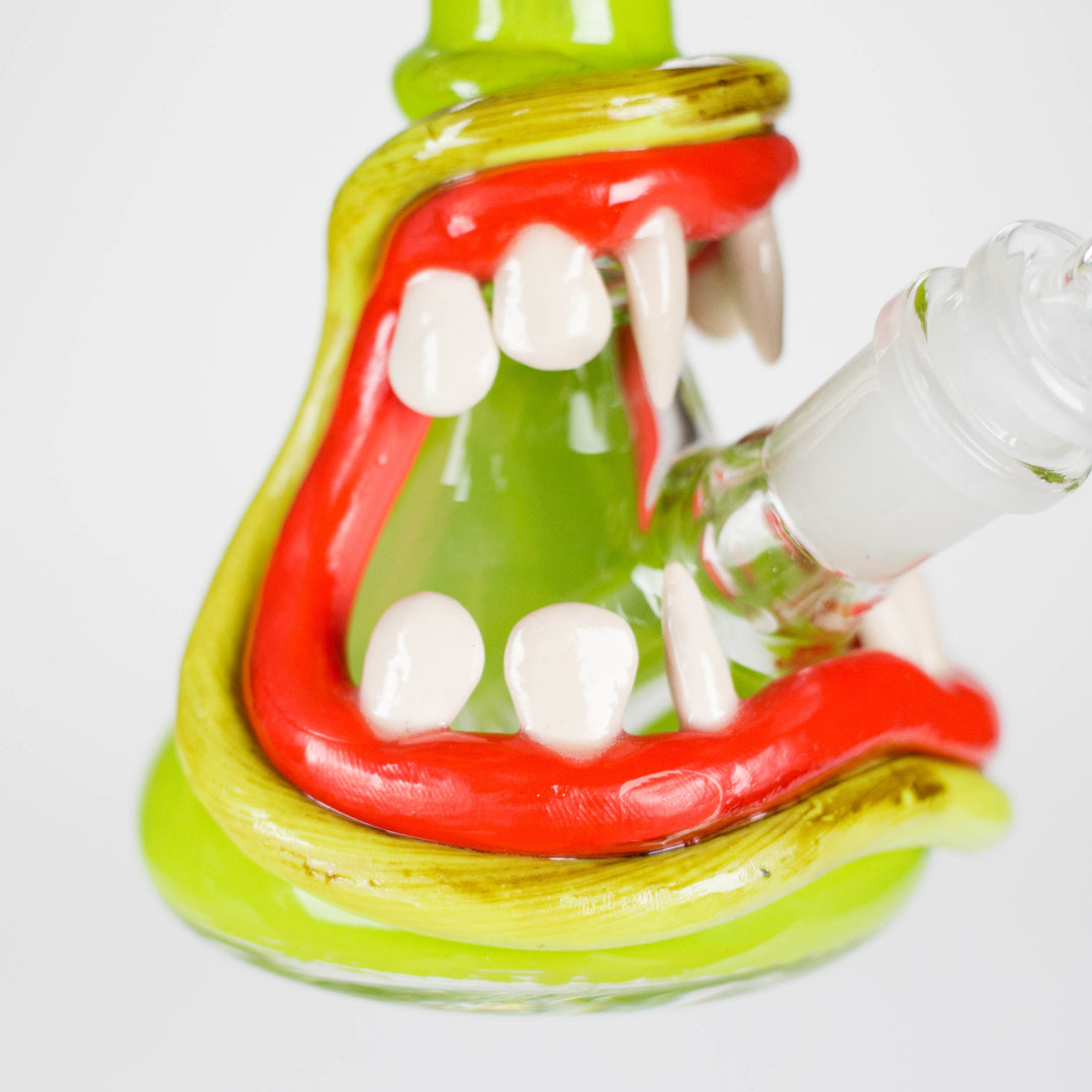 A close-up, side view of a blue and clear glass hand pipe with a swirled pattern, resting on a white background.