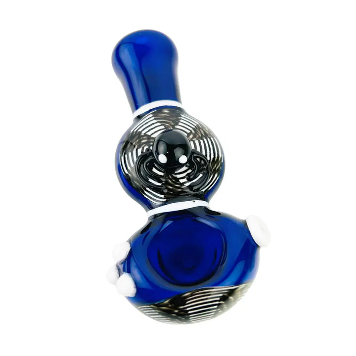 A vibrant blue glass hand pipe with a black and white swirling spider web design and a small black spider embellishment on the bowl, presented against a white background.