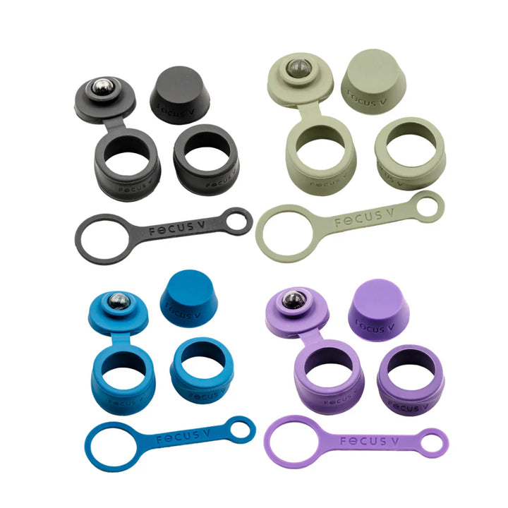 Four sets of silicone accessories in black, light green, blue, and purple, each including caps, rings, and a strap with 'FOCUS V' text, arranged on a white background.