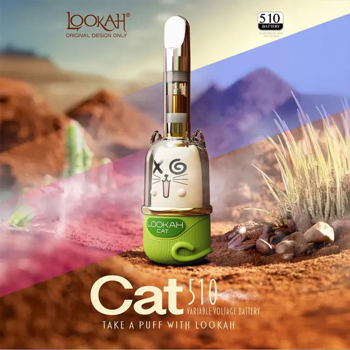 A cat-themed 510 cartridge battery with a white cat face and green base, featuring a clear cartridge, set against a stylized desert landscape with mountains and grass.