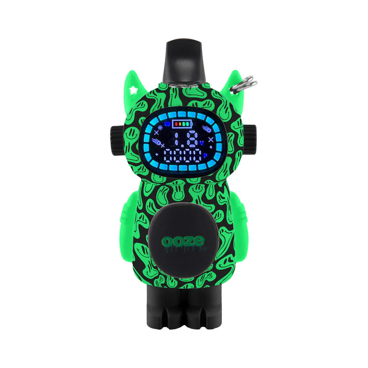 Front view of a green and black vape battery shaped like a small robot or character, featuring a digital display and a swirly pattern with subtle smiley faces.