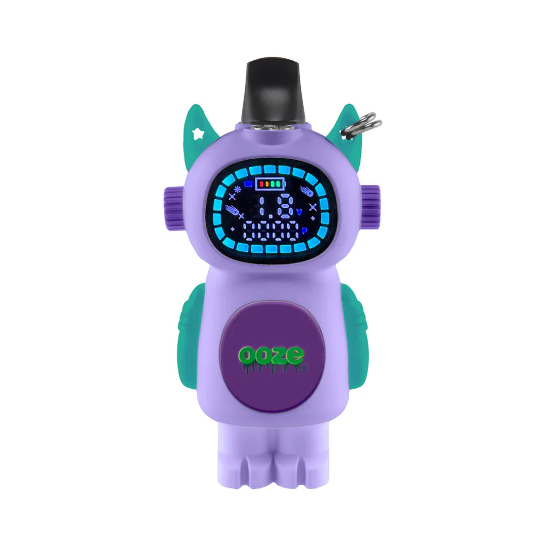 A purple, robot-shaped vape battery with teal accents and a black mouthpiece, featuring a digital display showing battery life and settings, and a green 'Ooze' logo on its chest.