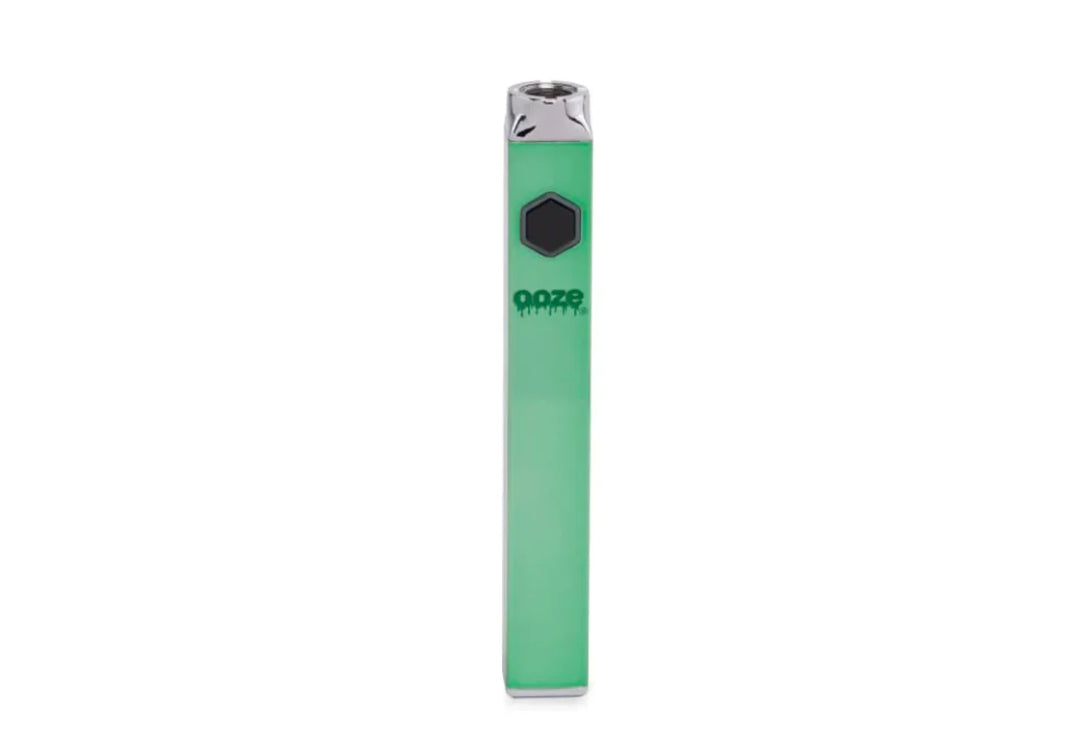 A single, light green, rectangular vaporizer battery stands upright against a white background, featuring a black hexagonal button and a silver mouthpiece.