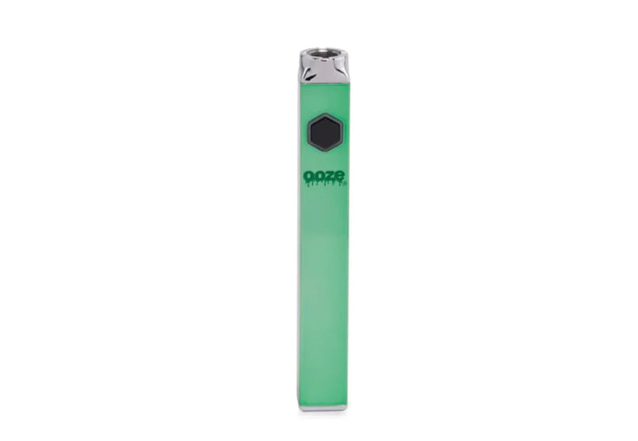 A single, light green, rectangular vaporizer battery stands upright against a white background, featuring a black hexagonal button and a silver mouthpiece.