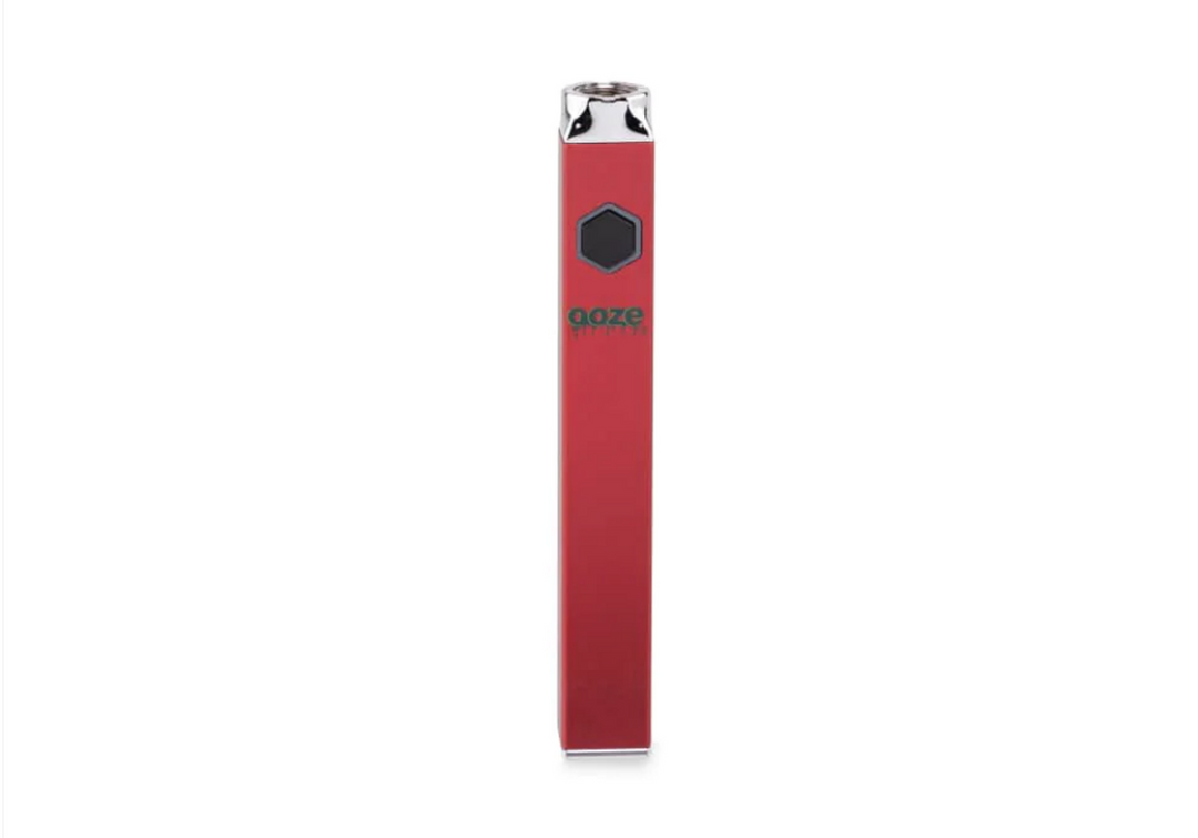 Front view of a sleek, red, square-shaped vaporizer battery with a black hexagonal button and a green 'ooze' logo on its face, set against a white background.