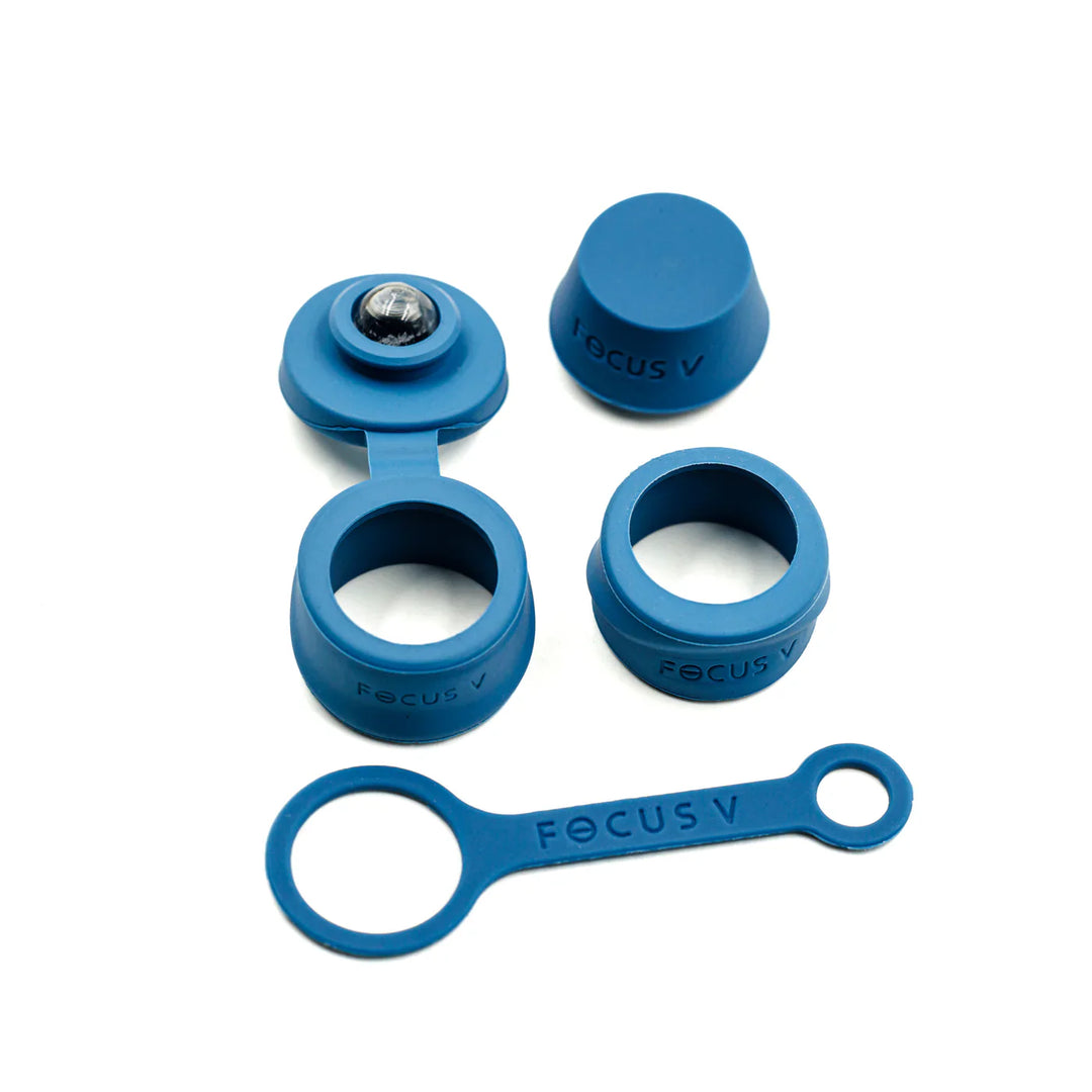 A set of various blue silicone accessories for a vaporizer, including caps, rings, and a strap, displayed on a clean white background.