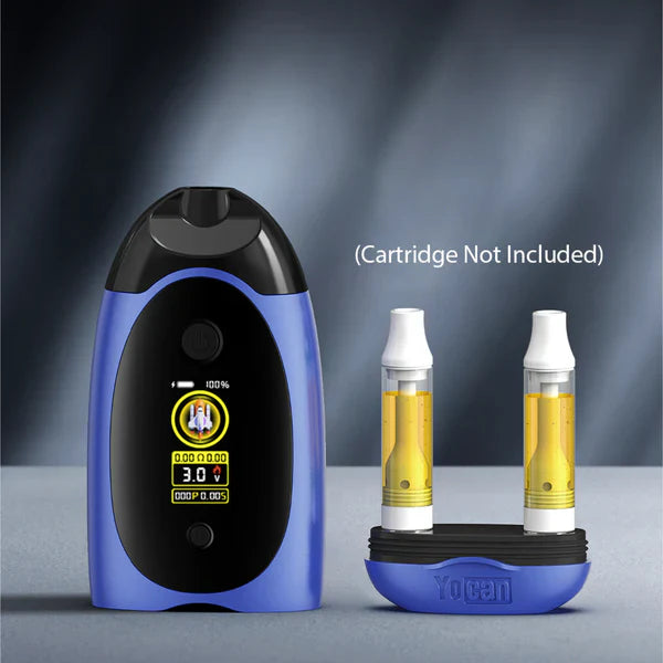 A blue and black vape mod with a digital screen displaying battery life and settings, positioned next to a blue and black stand holding two clear vape cartridges filled with amber liquid. Text on the image states 'Cartridge Not Included'.