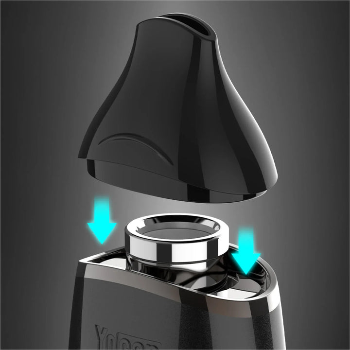 Close-up detail shot of a black vaporizer, showing its sleek, dark mouthpiece being aligned with the main body, with glowing blue arrows indicating the connection points for assembly.