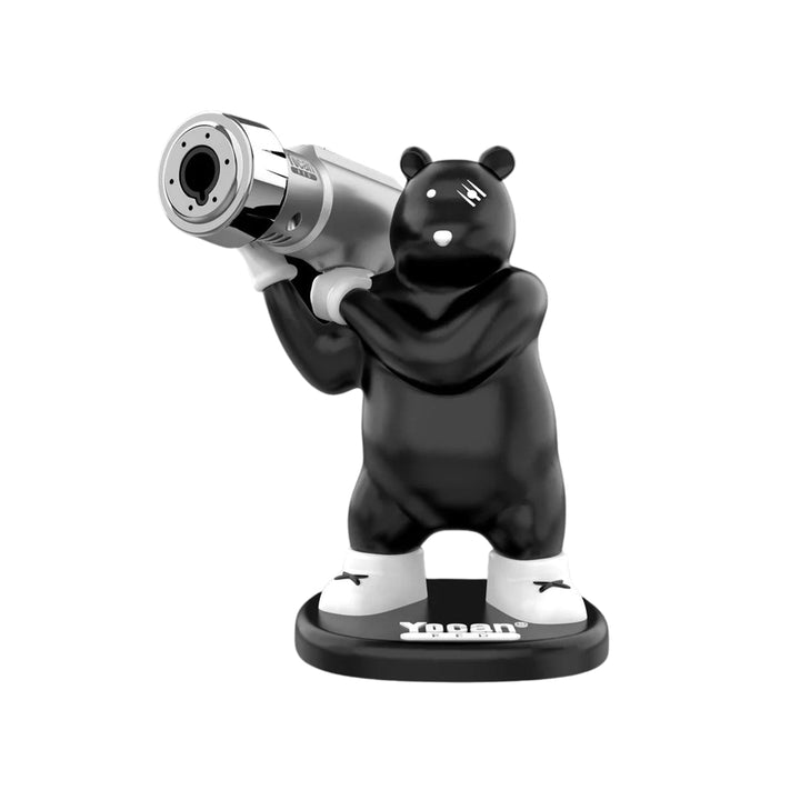 A black bear-like figure with white accents holding a silver high-output torch, standing on a black circular base with the 'Yocan' logo.