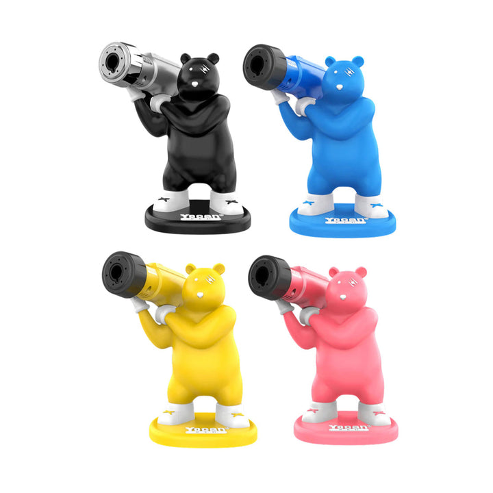 Four bear-shaped torch lighters in black, blue, yellow, and pink, each holding a matching or silver torch, standing on a white background.