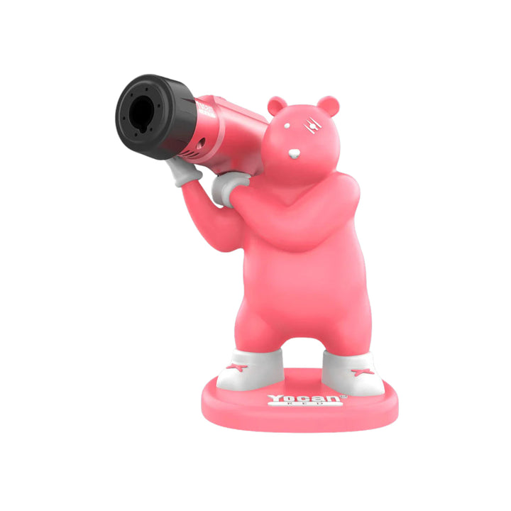 A pink bear figure holding a black and pink torch, standing on a pink base with 'Yocan' logo, against a white background.