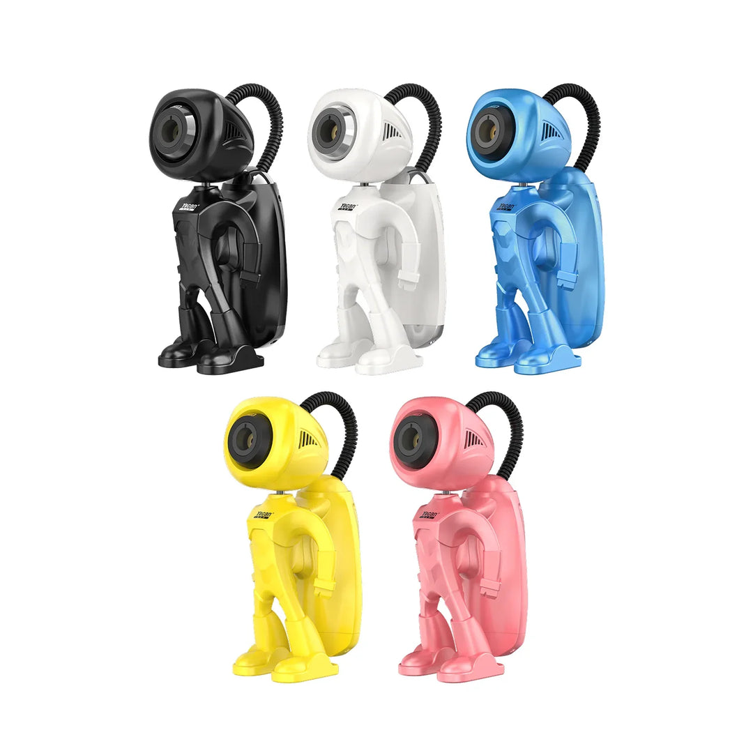 A collection of six small, colorful glass figurines, including red and green spotted mushrooms, a green plant-like figure, an orange bottle, a yellow and black bee, and a clear sphere, arranged in a line on a reflective surface.