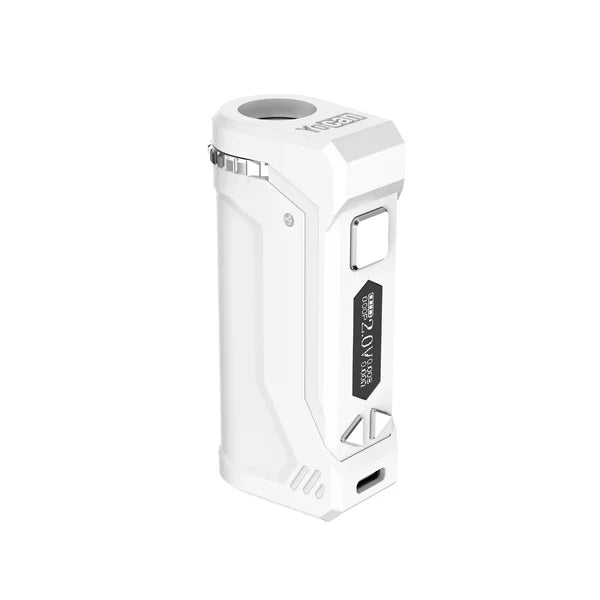 Close-up, angled view of a white Yocan UNI Pro 2025 Edition cartridge battery, showcasing its digital display, control buttons, and top cartridge slot.