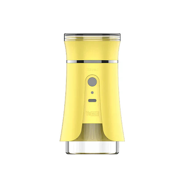 Front view of a bright yellow electric dry herb grinder with a clear bottom chamber and a silver button on the front.
