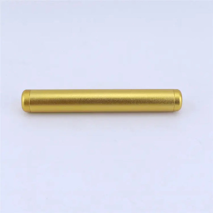 A straight-on, close-up shot of a single, sleek golden aluminum cylindrical tube, designed for odor-free travel storage, against a plain white background.