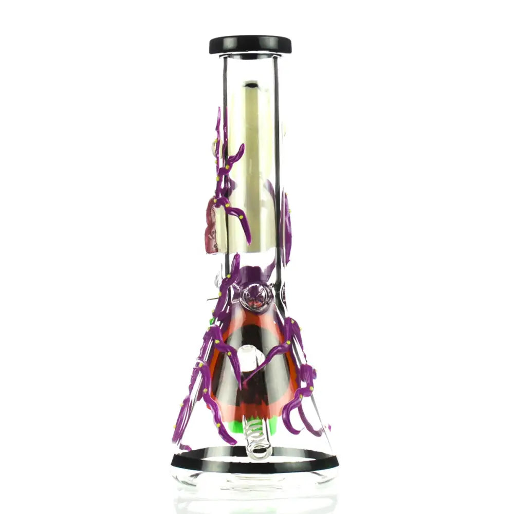 A clear glass beaker-shaped water pipe with intricate purple spider-like decorations wrapping around the body, featuring a black and orange design inside the base and a black rim.