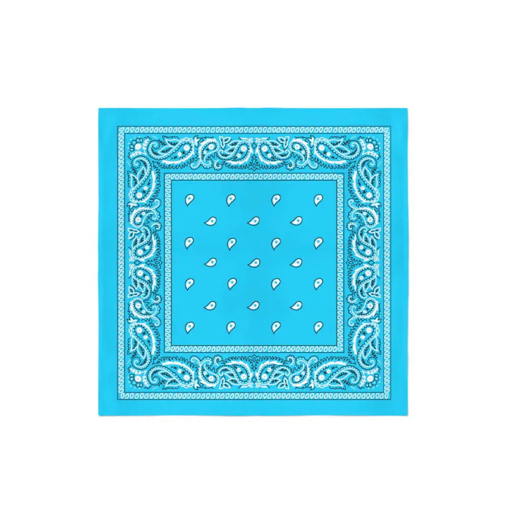 A square turquoise bandana with a white and black intricate paisley pattern along the border and scattered white paisley teardrops in the center.