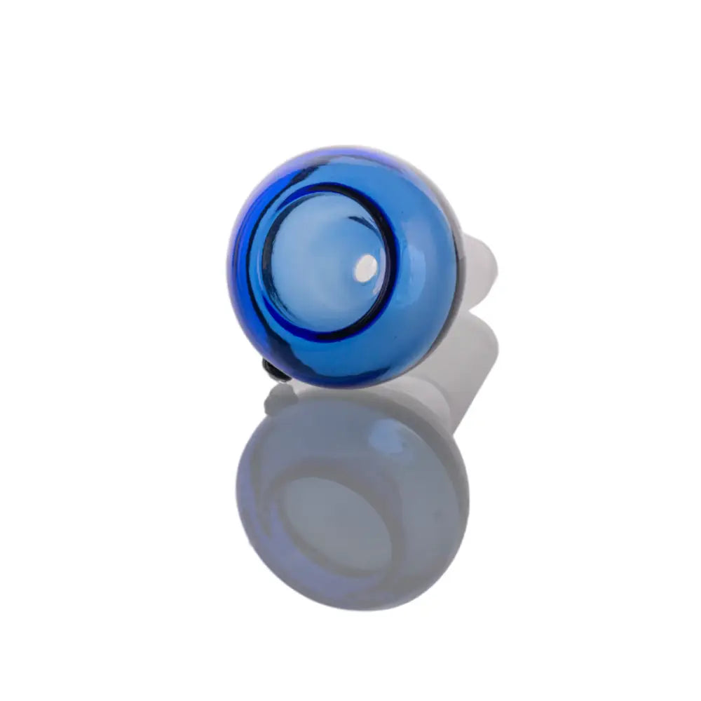 Close-up, slightly angled view of a spherical blue glass bowl with a clear joint, reflecting on a white surface.