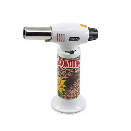 A white and brown torch lighter with a metallic nozzle and a black grip, featuring 'Backwoods' branding on the body with a camouflage-like pattern.