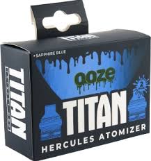 A rectangular black and blue product box for an atomizer, featuring 'Ooze Titan Hercules' branding and a dripping paint design, indicating a 2-pack.