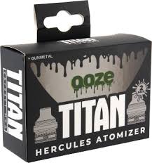 Close-up of a black cardboard retail box for Ooze Titan Hercules Atomizers, featuring white text, a green 'ooze' logo with a drip effect, and a clear window revealing the product inside. This is an image of the product's packaging.