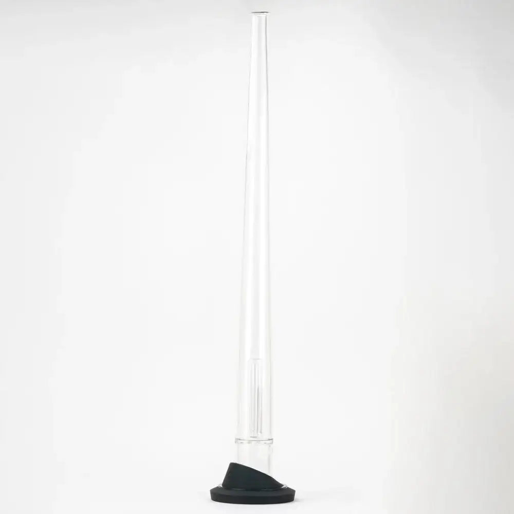 A tall, slender clear glass display stand with a black conical base, designed for a Peak attachment, shown upright against a white background.