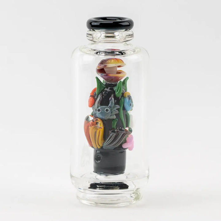 Clear glass vaporizer attachment featuring an intricate underwater scene with a clam, crab, fish, and colorful coral inside, set against a white background.