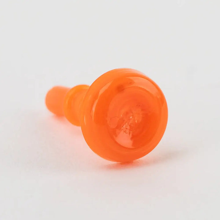 Close-up, angled shot of a translucent orange glass accessory with a rounded top and a stepped cylindrical base, designed for a vaporizer, set against a white background.