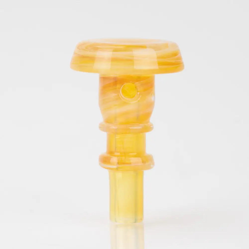 A small, translucent yellow and orange swirled glass accessory with a mushroom-shaped cap and a cylindrical stem featuring two rings.