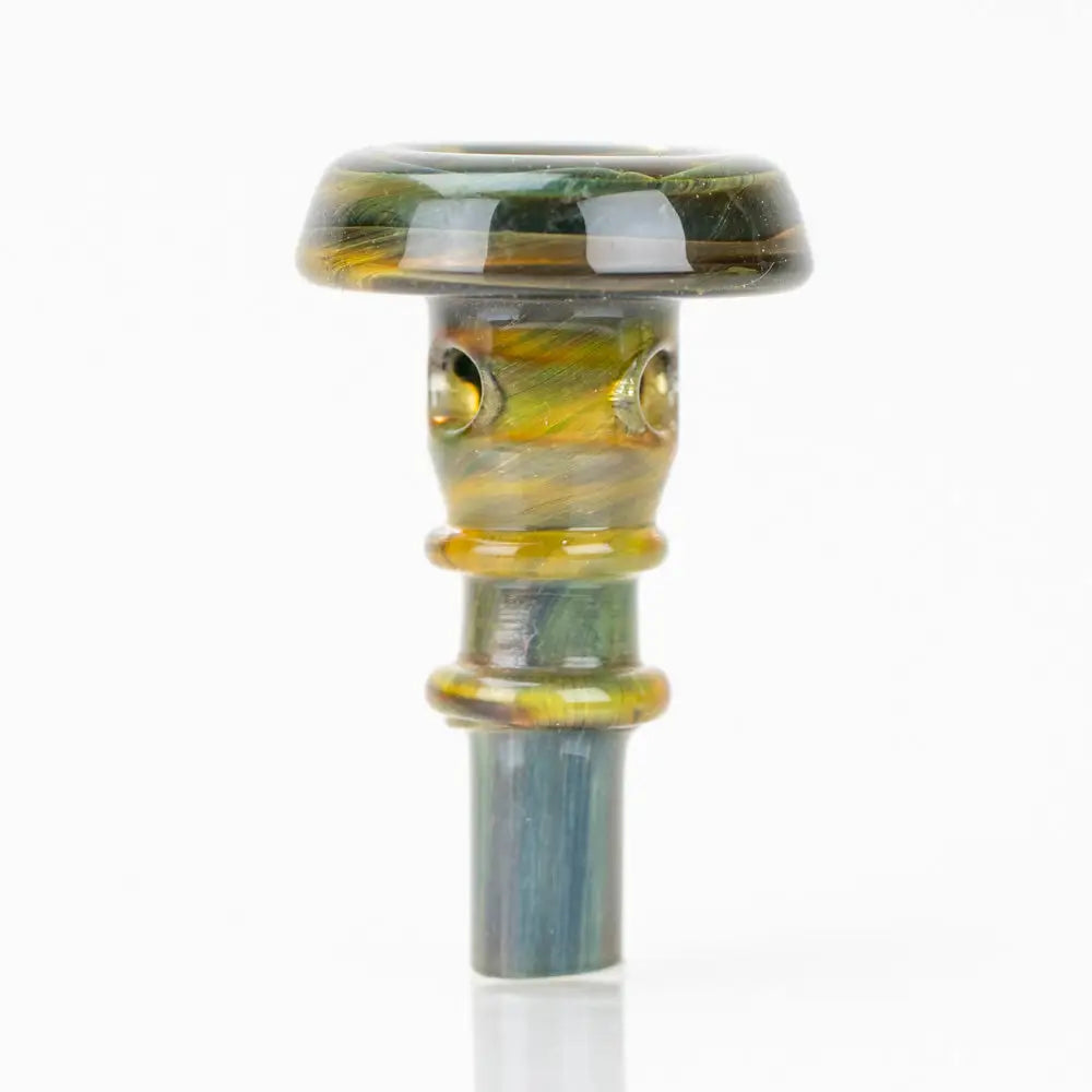 A small, colorful glass accessory with a wide, flat top and a cylindrical stem, featuring swirled patterns of green, gold, and blue hues. It has two small holes on the upper part of the stem.
