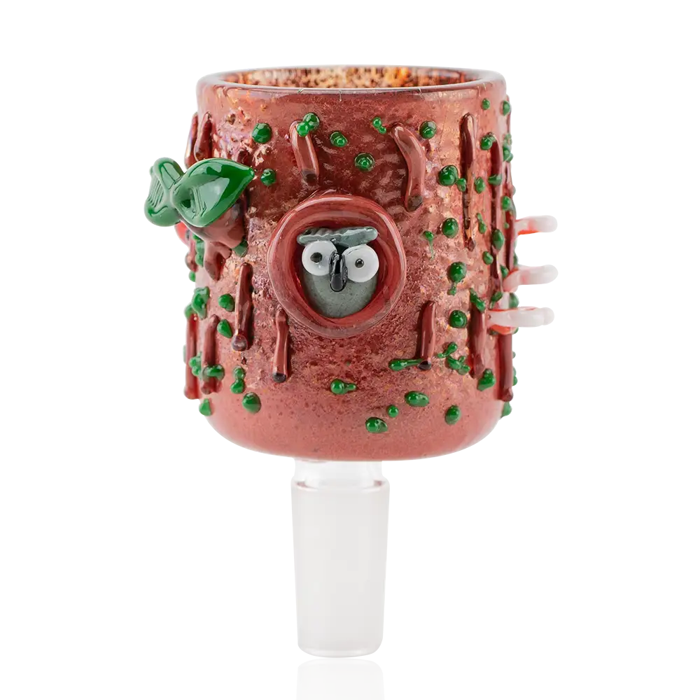A glass attachment resembling a tree trunk with an owl in a hollow, green leaves, and small mushrooms.