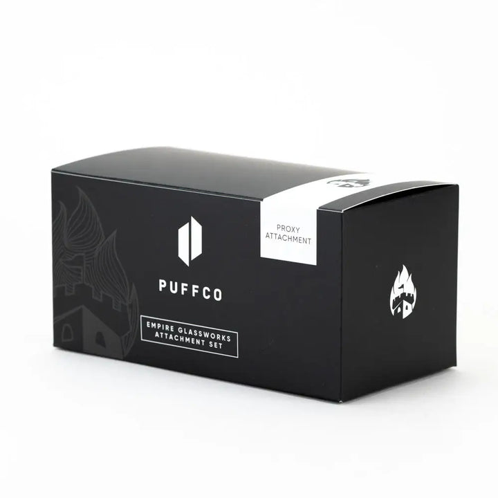 Black rectangular product box for a Puffco Proxy attachment, featuring white branding and a castle-like graphic on the left side, set against a plain white background.