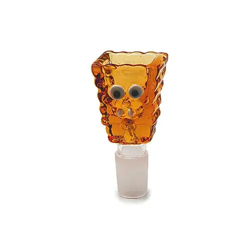 Close-up of an amber glass smoking bowl with a textured, square shape and googly eyes on the front.