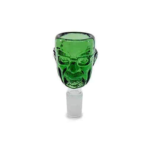 Close-up of a green glass smoking bowl shaped like a man's head with glasses and a mustache, featuring a clear male joint at the bottom.