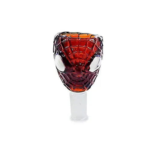 Close-up studio shot of a red glass smoking bowl shaped like Spider-Man's head with white eyes and a web pattern, featuring a clear male joint at the bottom.