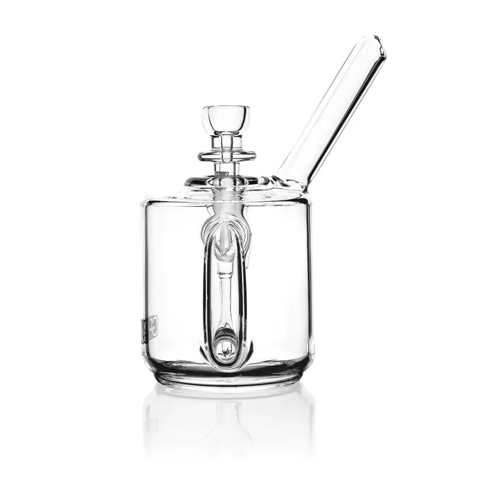 A clear glass bubbler with a cylindrical base, an internal downstem, and an angled mouthpiece, shown front-on against a white background.