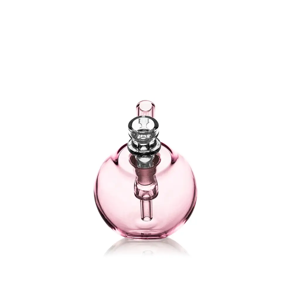 A compact, spherical pink glass bubbler with a clear glass mouthpiece and downstem, shown on a white background.