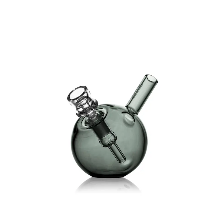 A black glass water pipe with a beaker base and a straight neck, featuring a colorful, freaky clown skull and graffiti-style design.
