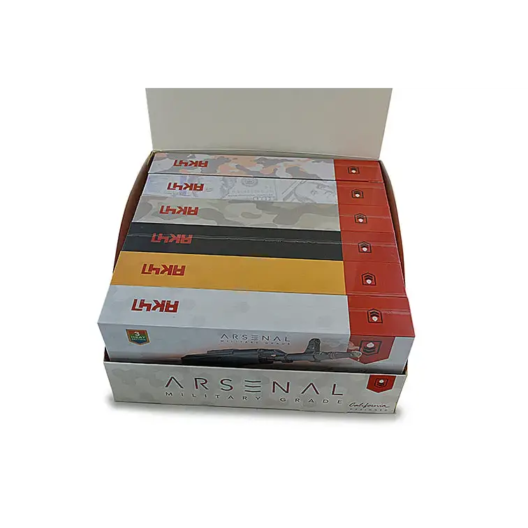A display box filled with multiple individual product boxes, each featuring a gun graphic and camouflage patterns, with 'AK47' and 'ARSENAL MILITARY GRADE' branding.