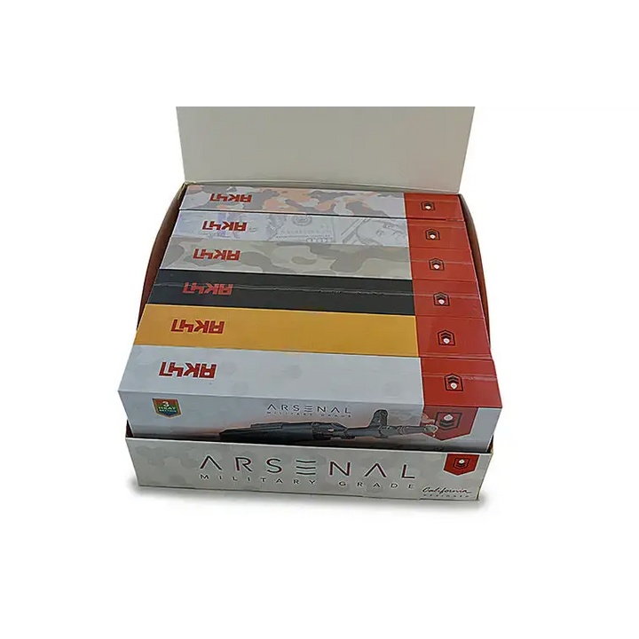 A display box filled with multiple individual product boxes, each featuring a gun graphic and camouflage patterns, with 'AK47' and 'ARSENAL MILITARY GRADE' branding.