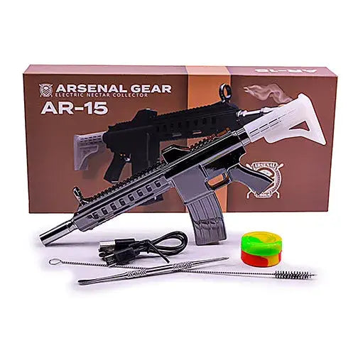 A black and silver AR-15 rifle-shaped electric nectar collector with a brown box and various cleaning tools and a silicone container.