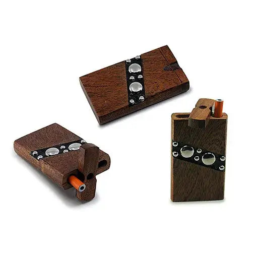Three different views of a dark brown wooden dugout with a silver studded decorative band, one showing the top, one showing the side with an orange-tipped one-hitter inserted, and another showing the dugout open with the one-hitter.