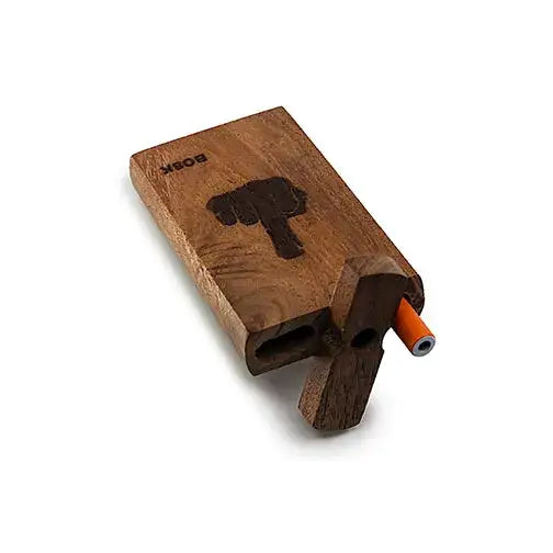 Close-up, angled view of a rectangular wooden dugout box featuring a carved middle finger design and 'BOSK' text, with an orange-tipped one-hitter partially extended from its side.