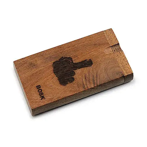 Close-up, angled view of a rectangular wooden dugout, featuring a dark brown middle finger graphic and 'BOSK' text on its surface.