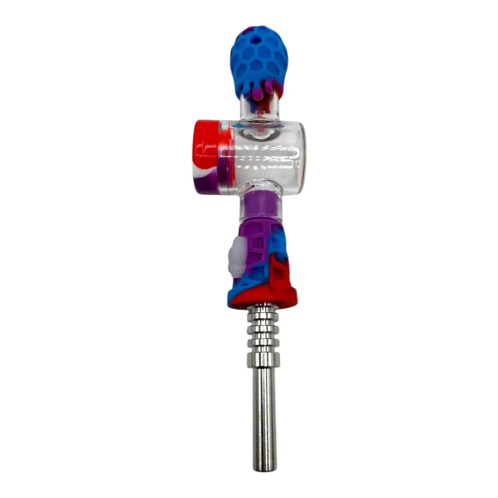 A colorful nectar collector with a clear glass body, blue honeycomb-patterned silicone mouthpiece, and red, purple, and blue silicone accents, featuring a silver metal tip at the bottom.